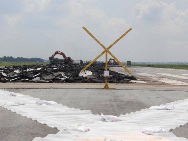 Close-up of Tan Son Nhat runway construction as travel delay increases