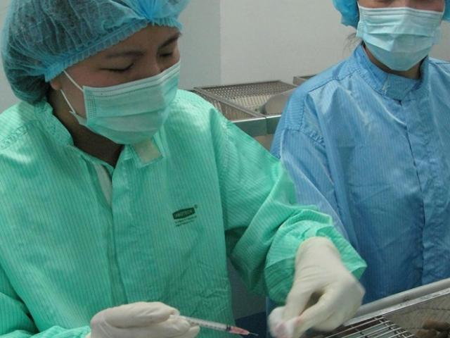 How is COVID-19 vaccine production progressing in Vietnam?